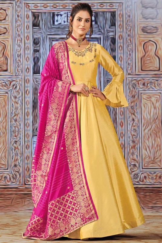 Beguiling Yellow Color Art Silk Fabric Savvy Suri Anarkali Suit With Contrast Dupatta